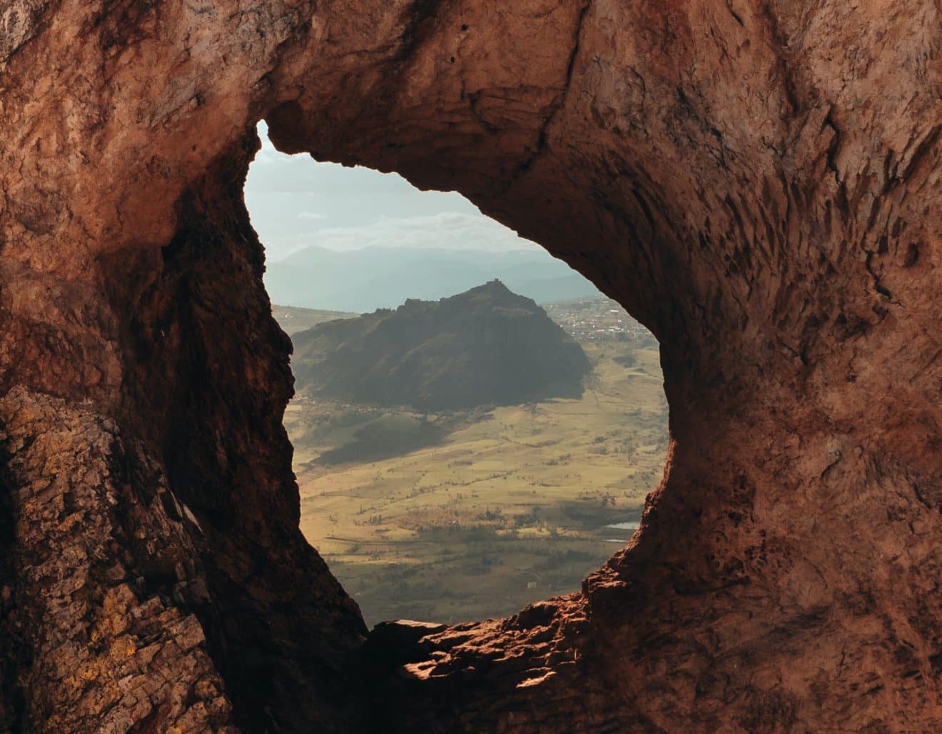 Hole in rock to see mountain